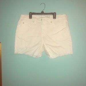 White cut off jean shorts.